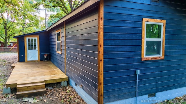 view of side of property with crawl space