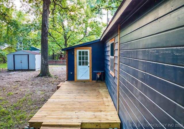 exterior space with fence and a wooden deck