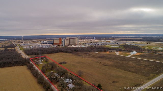 birds eye view of property with a rural view