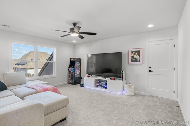 living area with light carpet, baseboards, visible vents, and recessed lighting