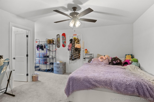 bedroom with a ceiling fan and carpet