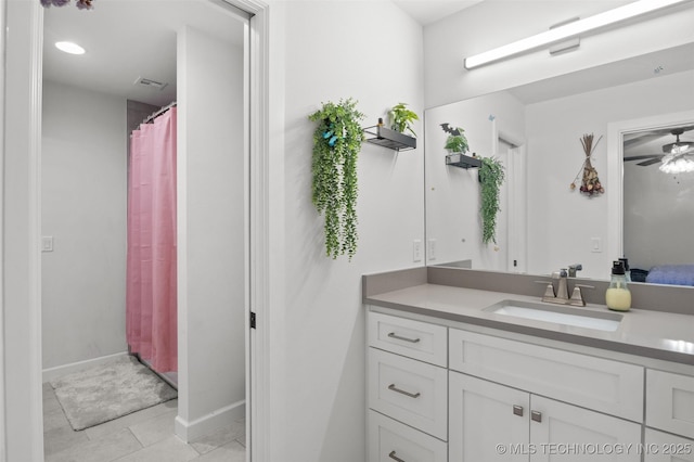 full bathroom with visible vents, baseboards, vanity, a ceiling fan, and tile patterned floors