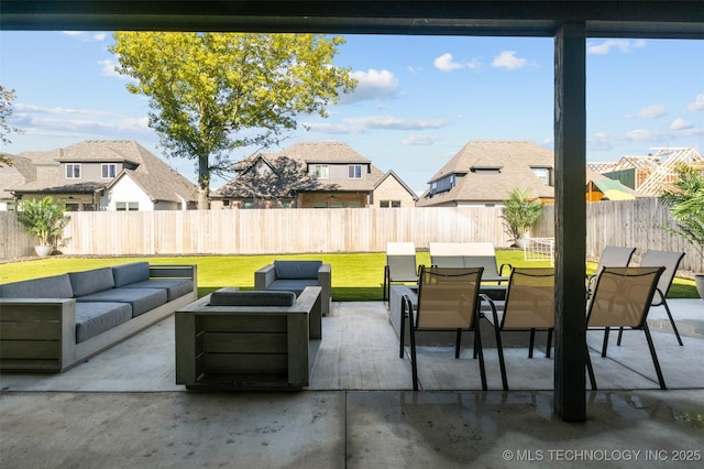 view of patio featuring an outdoor hangout area, outdoor dining area, a fenced backyard, and a residential view