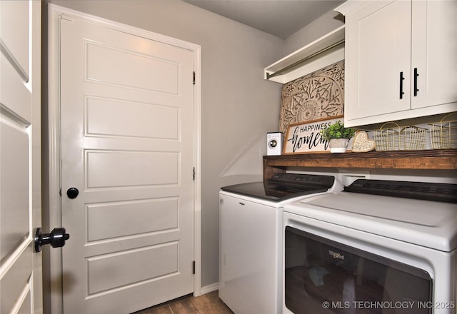 clothes washing area with cabinet space, washing machine and dryer, and dark wood finished floors