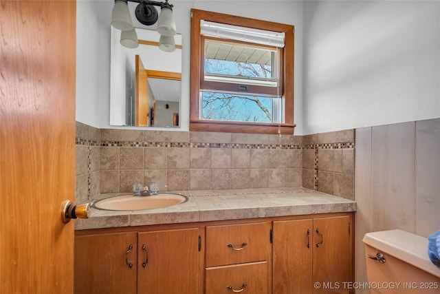 half bathroom with toilet and vanity