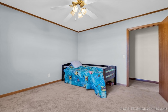 bedroom with baseboards, ornamental molding, a ceiling fan, and light colored carpet