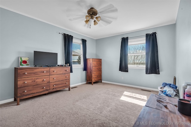 bedroom with light carpet, ceiling fan, baseboards, and ornamental molding