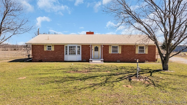 single story home with crawl space, brick siding, a chimney, and a front lawn