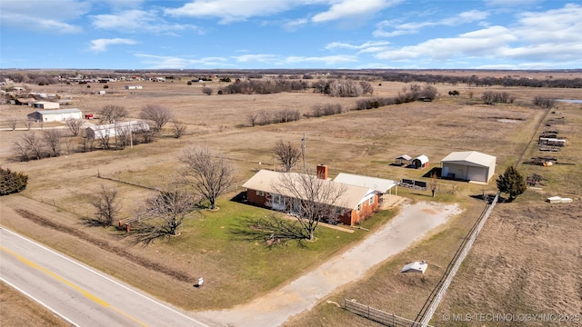 birds eye view of property featuring a rural view