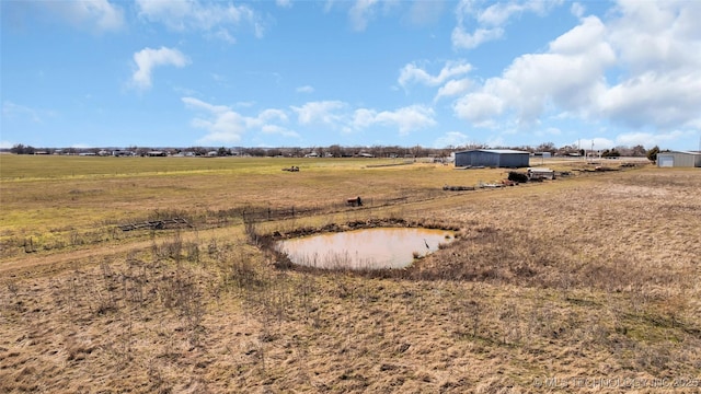 view of yard with a rural view