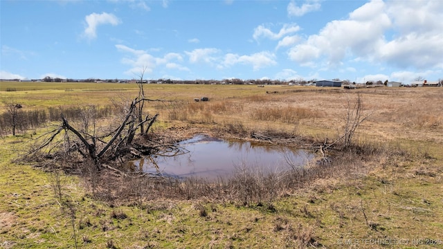 view of nature featuring a water view and a rural view