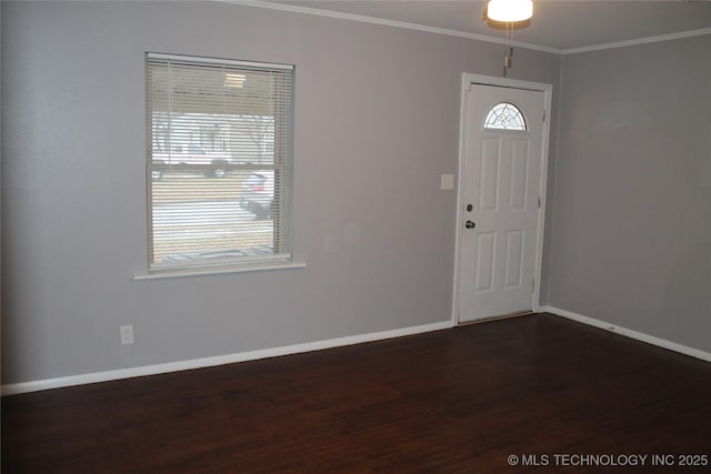 entrance foyer featuring baseboards, crown molding, and dark wood-type flooring