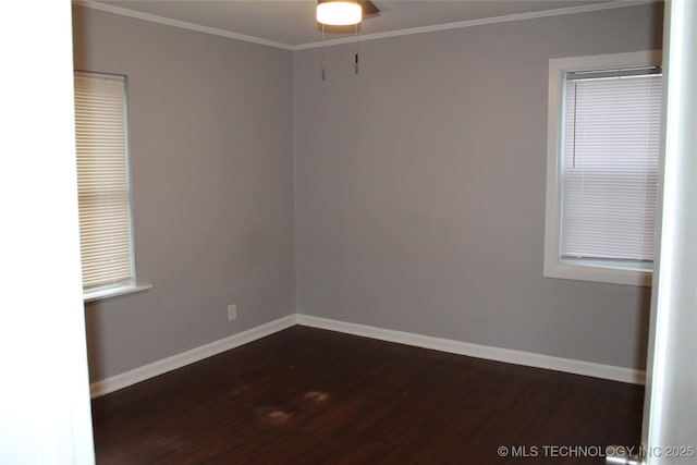 unfurnished room featuring dark wood-type flooring, baseboards, and ornamental molding