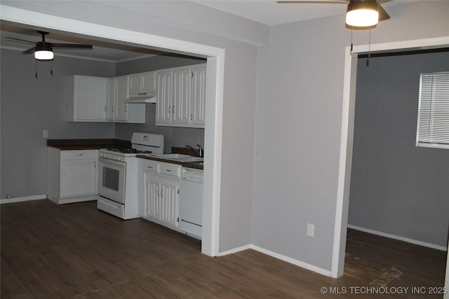 kitchen featuring under cabinet range hood, white appliances, dark countertops, and white cabinets