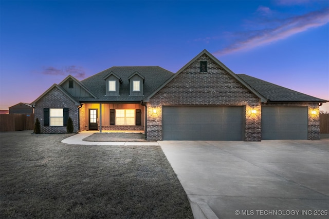 view of front of house with a garage, concrete driveway, a shingled roof, and fence