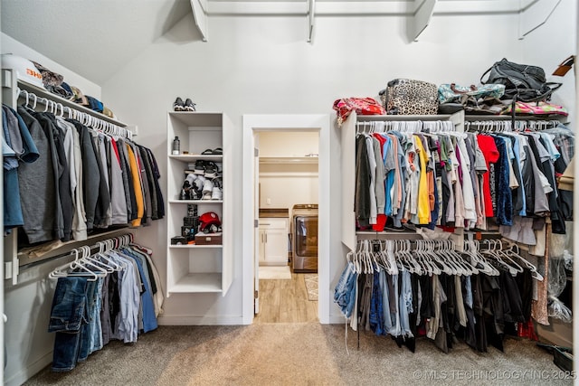 spacious closet with carpet floors and lofted ceiling