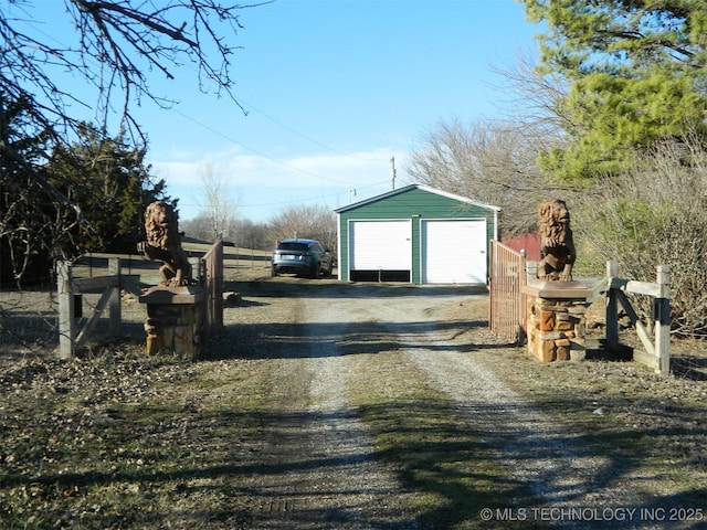 view of road featuring dirt driveway