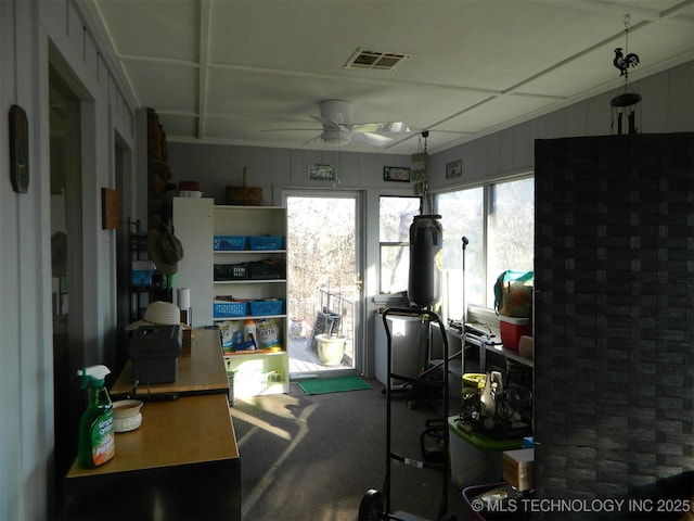 interior space featuring visible vents and a ceiling fan