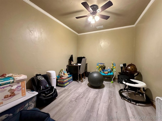 game room featuring ceiling fan, visible vents, crown molding, and wood finished floors