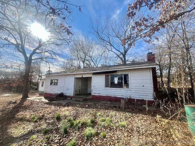 view of front of home with a chimney