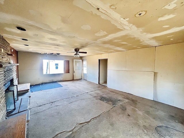 empty room with a brick fireplace