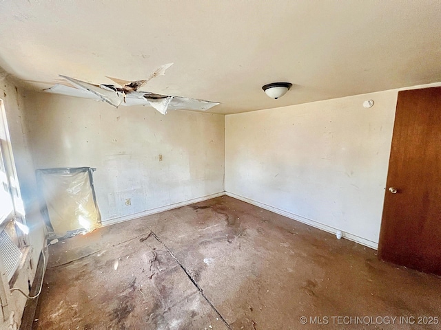 empty room featuring baseboards