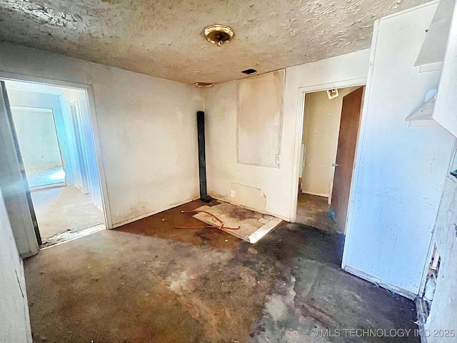 spare room with concrete floors