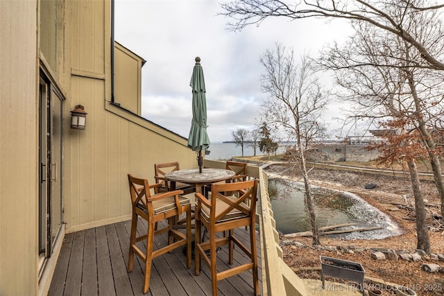 29898 S 566th Rd Unit 411, Afton, OK 74331 - wooden deck featuring outdoor dining area and a water view