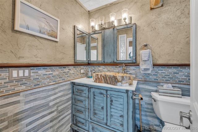 29898 S 566th Rd Unit 411, Afton, OK 74331 - half bathroom with toilet, vanity, tile walls, and wainscoting