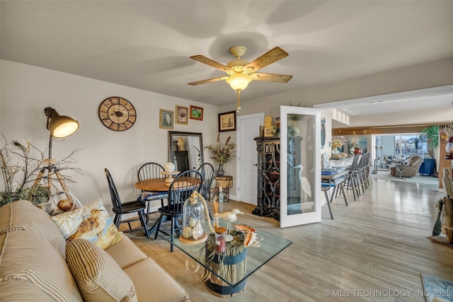 29898 S 566th Rd Unit 411, Afton, OK 74331 - living room with wood finished floors and a ceiling fan