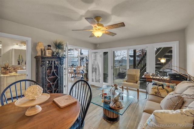29898 S 566th Rd Unit 411, Afton, OK 74331 - dining area with plenty of natural light, ceiling fan, wood finished floors, and a textured ceiling