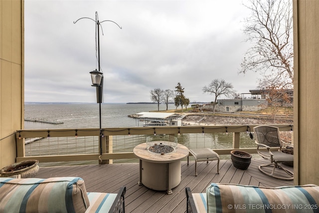 29898 S 566th Rd Unit 411, Afton, OK 74331 - wooden terrace with a fire pit and a water view