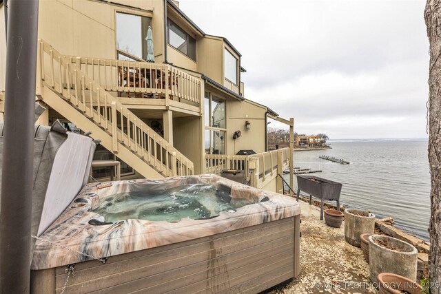 29898 S 566th Rd Unit 411, Afton, OK 74331 - view of patio featuring a hot tub, a deck with water view, and stairway