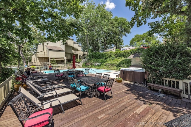 29898 S 566th Rd Unit 411, Afton, OK 74331 - wooden deck with a hot tub and outdoor dining space