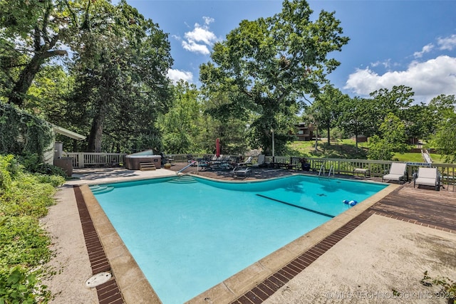 29898 S 566th Rd Unit 411, Afton, OK 74331 - view of swimming pool with a wooden deck, view of wooded area, and a patio area