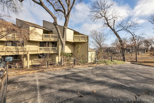 29898 S 566th Rd Unit 411, Afton, OK 74331 - view of building exterior with uncovered parking
