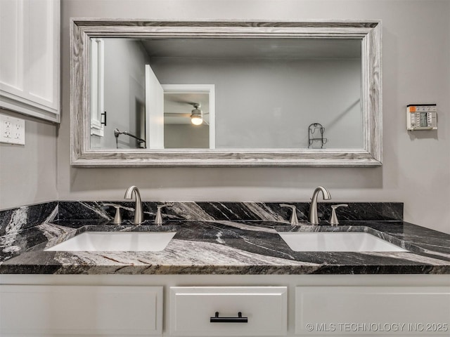 full bath featuring double vanity and a sink