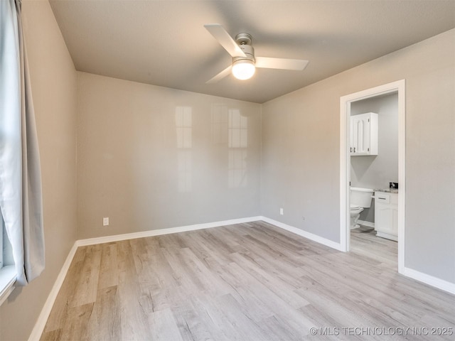 unfurnished room with light wood-style floors, ceiling fan, and baseboards