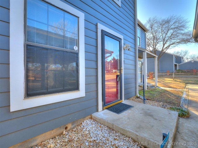 doorway to property featuring a patio area