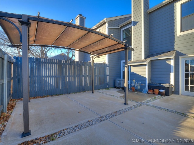 view of patio / terrace with a fenced backyard and central AC