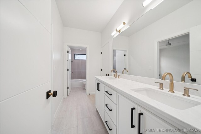 1641 E 32nd St, Tulsa, OK 74105 - bathroom featuring double vanity and toilet
