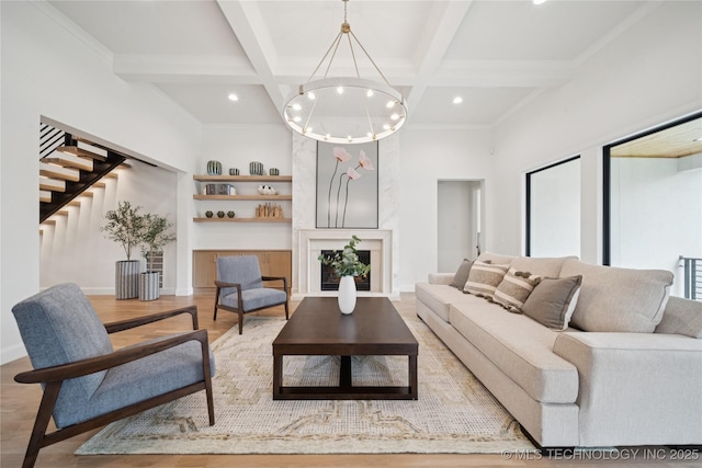 1641 E 32nd St, Tulsa, OK 74105 - living area featuring coffered ceiling, beam ceiling, built in shelves, stairway, and a chandelier