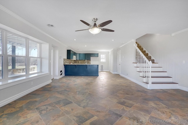 unfurnished living room with crown molding, visible vents, stairway, stone finish flooring, and baseboards