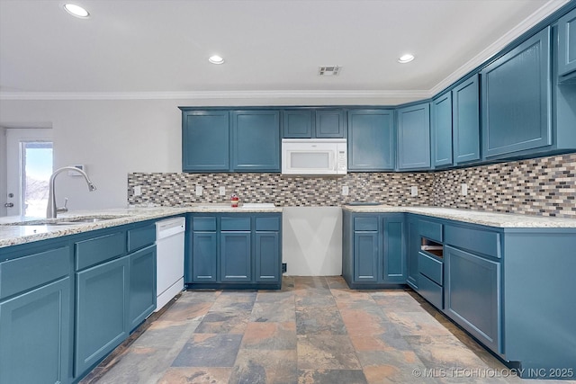 kitchen with tasteful backsplash, white appliances, a sink, and blue cabinetry