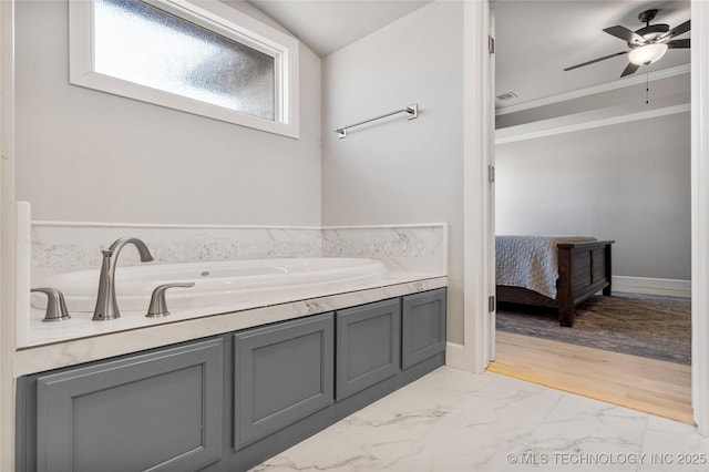 ensuite bathroom with connected bathroom, a ceiling fan, baseboards, marble finish floor, and crown molding