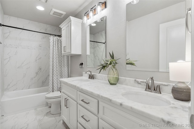 bathroom featuring marble finish floor, shower / bathtub combination with curtain, visible vents, and a sink