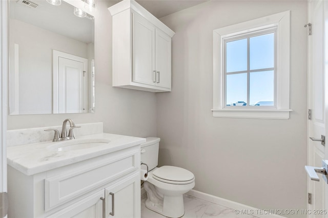 bathroom with visible vents, baseboards, toilet, marble finish floor, and vanity