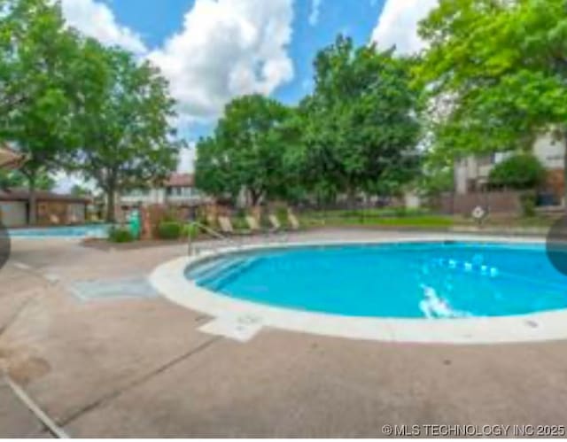 pool with a patio