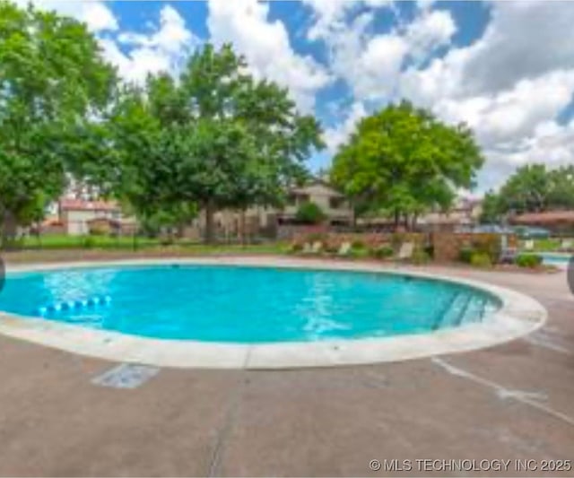 view of pool with a fenced in pool