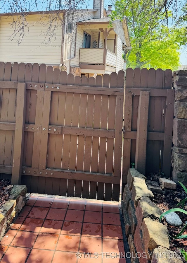 view of gate with fence